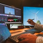 creator works on a multimedia project at his workstation.