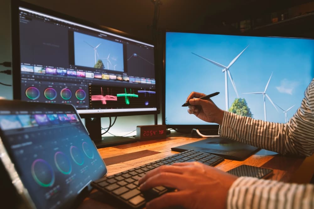 creator works on a multimedia project at his workstation.