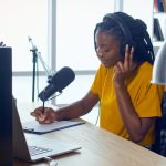 A young journalist delivers a report for a streaming newscast