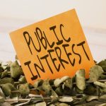 A conceptual image of a sign with the words "public interest"