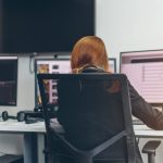 A digital journalist works at her desk