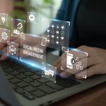 A conceptual image of a woman's hands working on a laptop overlaid with social media-related icons