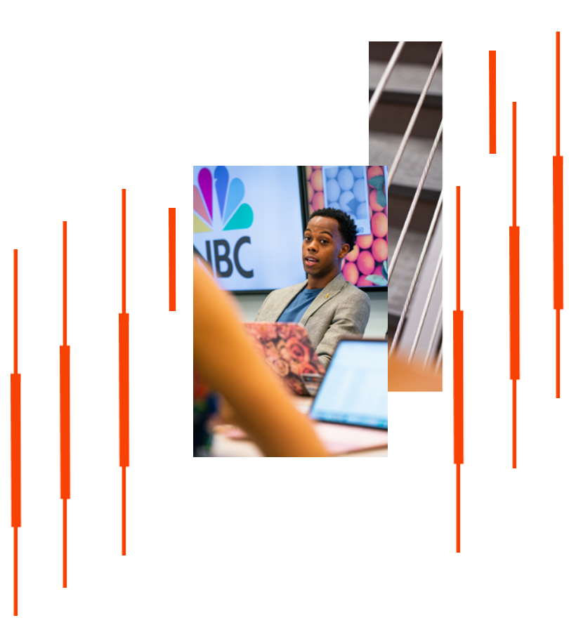 Young profession man in front of NBC sign Young profession man in front of NBC sign